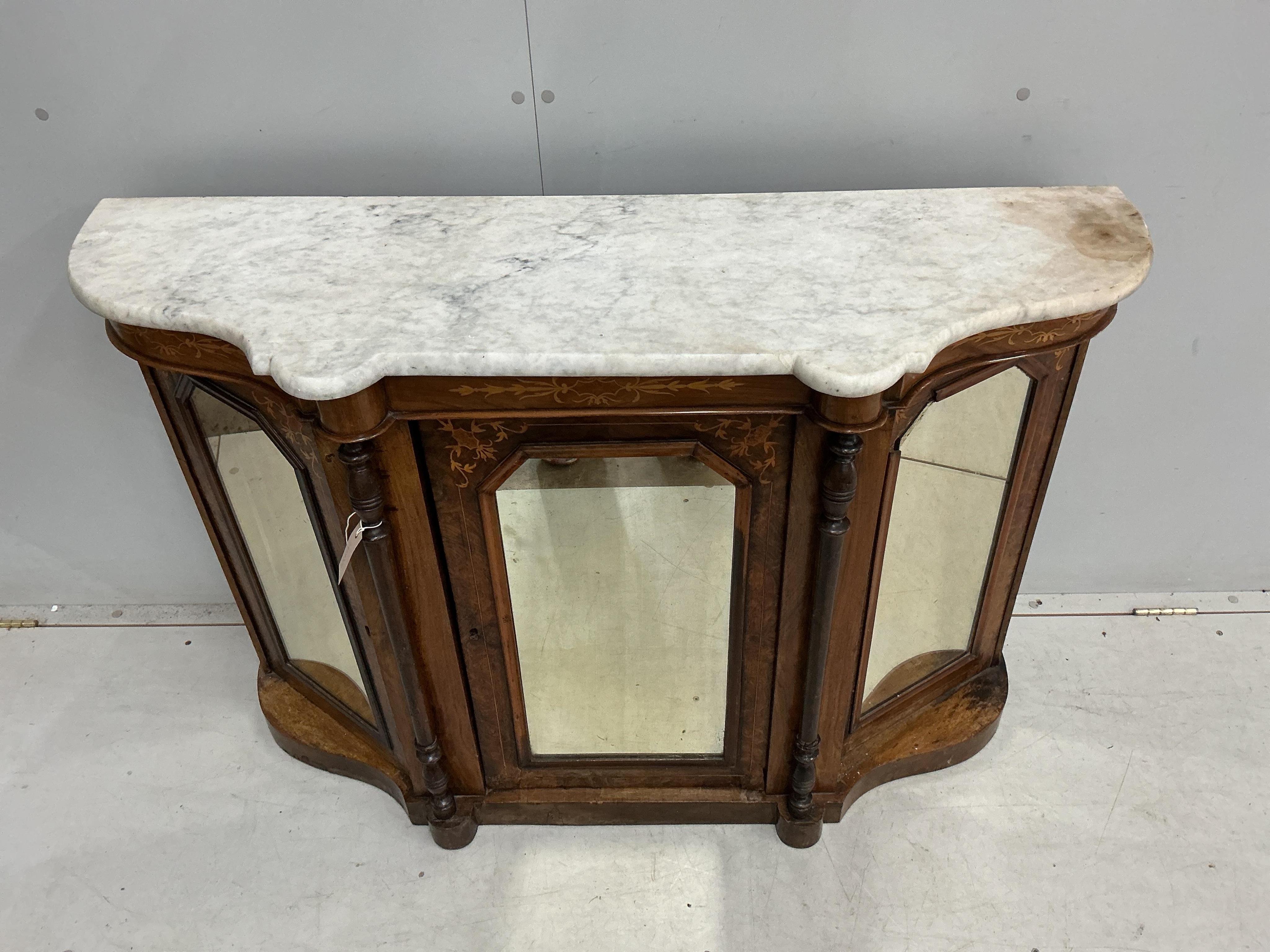 A late Victorian marquetry inlaid marble topped mirrored walnut side cabinet, width 122cm, depth 39cm, height 84cm